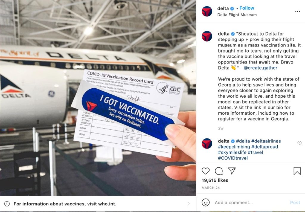 A screenshot of an Instagram post on Delta's feed. It shows a photo submitted by a person holding a sticker that says they got vaccinated – with a testimonial and Delta's airplane in the background