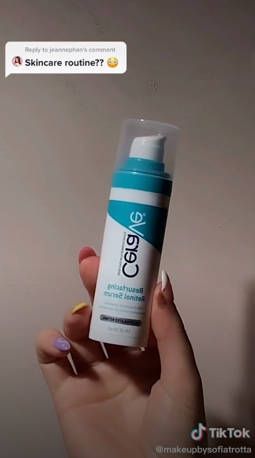 A screenshot of a TikTok video featuring Cerave bottle and a hand holding it. The top left shows a question by the user's fan asking for her "skincare routine??" 