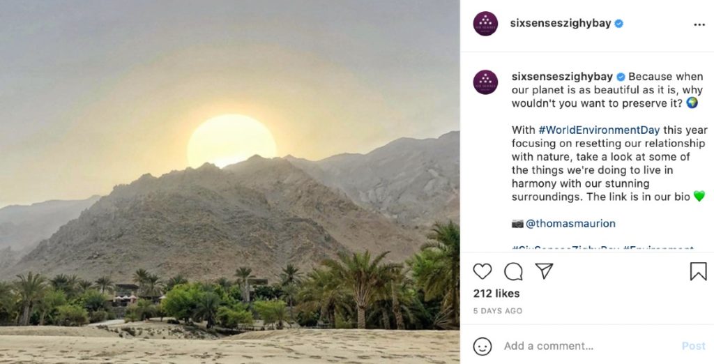 A screenshot of @SixSensesZighyBay's Instagram displaying an image of a sunrise or sunset behind a mountainous landscape. The description references #WorldEnvironmentDay and focusing on resetting their relationship with nature. They also tagged the original creator of the image (@thomasmaurion)