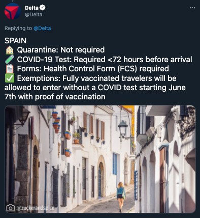 A tweet within Delta's thread about countries reopening. This tweet is about Spain and uncovers whether or not quarantine, COVID-19 tests, forms, and exemptions are required. The tweet also features user-generated content of a woman walking between Spanish buildings. 