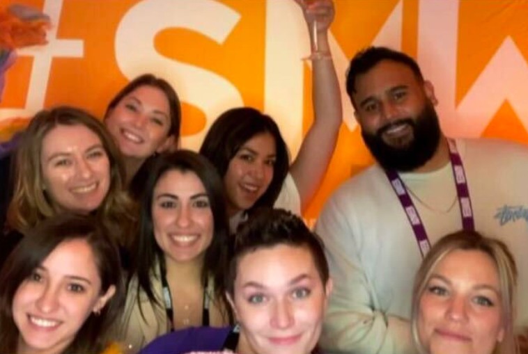 A group of people at a selfie booth