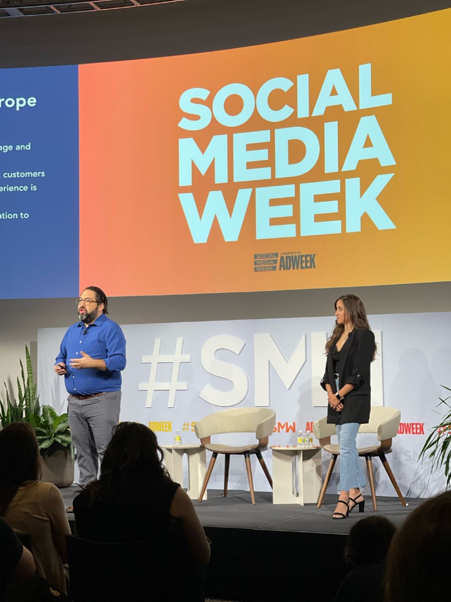 A man and woman presenting at Social Media Week