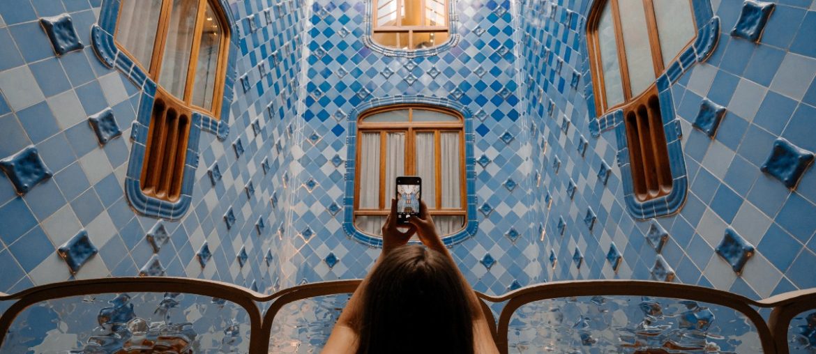 A woman taking a selfie of a building